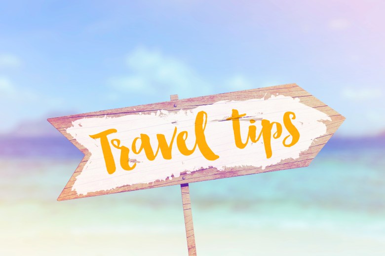 Travel tips summer wooden beach arrow sign